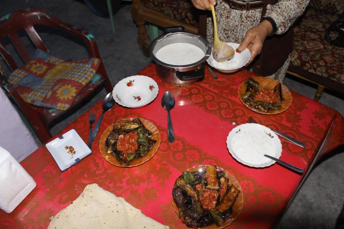 Kurdish dinner at a homestay, shakshuka and bulgur soup.